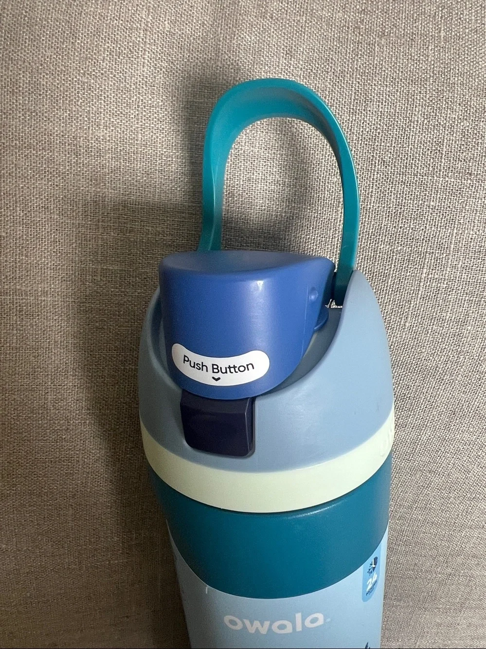 Owala FreeSip Stainless Steel Water Bottle in a 24 oz size blue & teal color